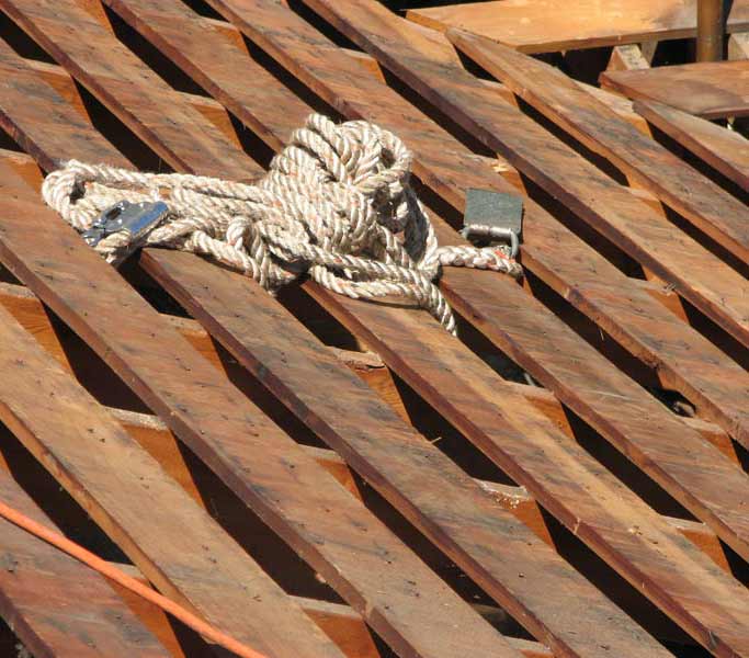 Steep roof tear-off to sheathing boards in Marin County